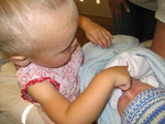 Big sister picking nose