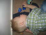 Paul supposed to be asleep in his big boy bed but was playing on the floor and fell asleep, toy car in hand.