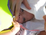 Trying to soothe Madison's hatered of the lifejacket