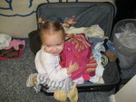 Madison climbed into the suit case and then repacked it