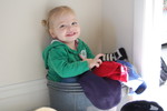 Madison playing in Grandma Newsome's hat basket