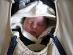 In the car seat getting ready for a winter walk outside