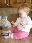 But she doesn't like the chocolate on her hands!