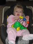 Madison loves to sit in her old car seat to watch cartoons