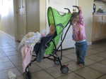 Madison pushing Paul around the house in the stroller - both of them loved it