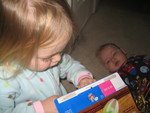 Madison checking out her birthday breakfast cereal her favorite frosted flakes (Paul wanted some too)