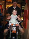 Madison and Daddy riding the motorcycle at the Pine Ridge Mall in Chubbuck