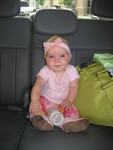 Madison sitting in the back seat of the van after a long day of shopping