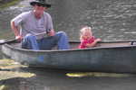Grandpa Newsome and Madison in the canoe at Rockn' R Ranch