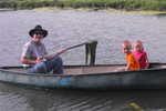 Grandpa Newsome and Madison and Ethan in the canoe at Rockn' R Ranch 2