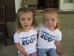 Clara and Madison in their cousin camp shirts