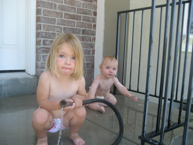 Madison and Paul loved playing in the hose on the portch