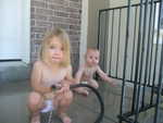 Madison and Paul loved playing in the hose on the portch