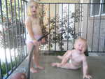 Madison and Paul playing with water on the front portch