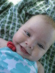 After playing in the water at the pool Madison was ready for a rest in the shade on a blaket