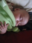 Madison loves to cuddle with her frog blanket while napping