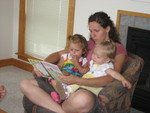 Aunt Jessica reading a book at the beach house to Madison and Isabell
