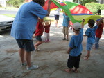 Cousin camp - playing with a parachute