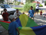 Cousins playing with parachute at cousin camp