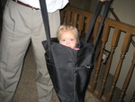 Jordan carrying Madison around in a bag