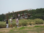 Jordan sitting on the life size Wright Brothers airplane