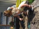 Madison and Grandma weeding in the garden