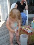 Madison enjoyed painting her belly at cousin camp with Grandma