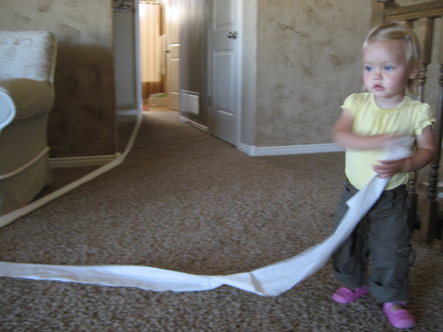 Madison getting a tissue from the bathroom for her nose