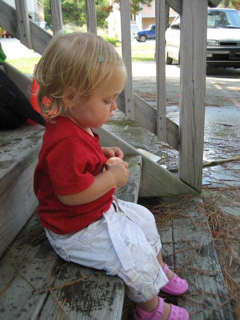 Madison holding her water balloon and treating it like a baby