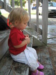 Madison holding her water balloon and treating it like a baby