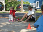 Madison trying to ride a scooter