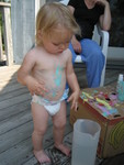 Madison working on a craft with Grandma Smith - More paint ended up on her belly than the picture frame