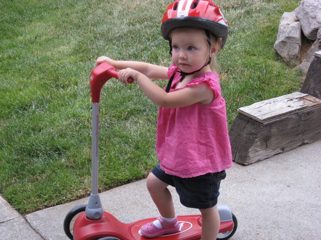 Madison learned how to ride a scooter in Oregon with Ethan as her teacher