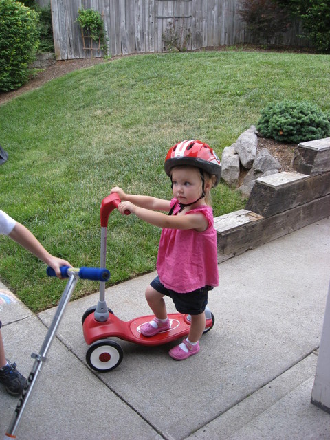 Madison learned how to ride a scooter in Oregon with Ethan as her teacher