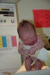 Nurse cleaning Madison after delivery