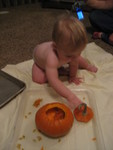 Carving pumpkins - Madison working hard.JPG