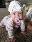 Madison with her diaper cover on her head