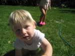 playing in the sprinklers