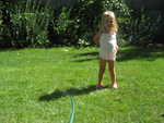 running through the sprinklers in our back yard