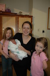 Cousin Lauren and Melanie and Aunt Karen visiting Madison in the hospital